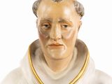 a figurine of a man with a collar around his neck