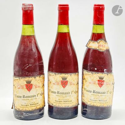 trois bouteilles de vin posées les unes à côté des autres sur une surface blanche