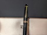 a pen that is sitting in a box on a table