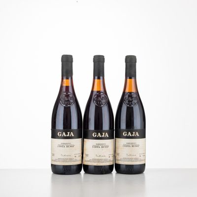 three bottles of wine sitting on top of a table