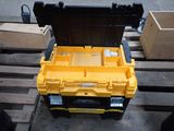 a yellow tool box sitting on a pallet on a pallet