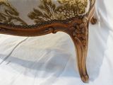 a chair with a floral upholstered seat on a white background