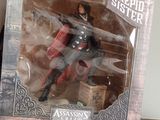 a box with a figure of a man in a red cape