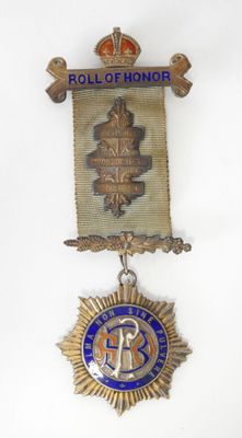 l'image d'une médaille surmontée d'une couronne