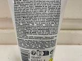 a close up of a tube of hand cream on a counter