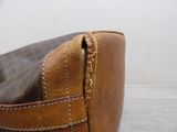 a close up of a purse on a table