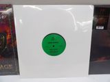 a white vinyl album with a green label on it