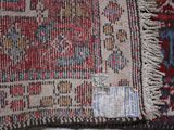 a close up of a rug with a tag on it