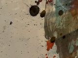 a person holding a cell phone in their hand with blood all over it
