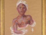 une peinture à l'huile représentant une femme coiffée d'un turban, dans un cadre doré