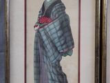 an old picture of a woman in a blue and green kimono