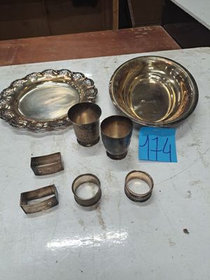 a table with a lot of silver items on it