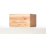 wooden box with a wine label on it sitting on a table