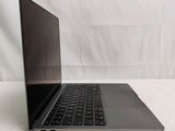 an open laptop computer sitting on top of a white surface