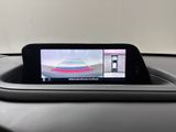 the rear view mirror of a car with a camera attached to it