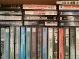 a lot of dvds on a shelf in a room