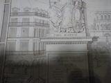un dessin représentant une statue sur le mur d'un immeuble