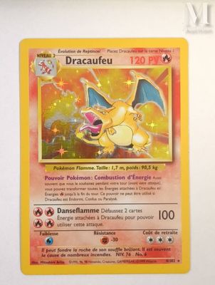 a close up of a pokemon card on a white surface