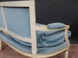 an image of a blue and white chair sitting on top of a carpeted floor