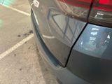a close up of a car ' s tail end with a sticker on it