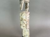 statue of a man with a helmet on his head on a black base