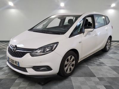 a picture of a white car parked in a garage