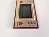a small electronic device sitting on a white surface