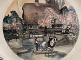 a plate with a picture of a horse drawn carriage