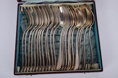 a lot of silver spoons in a box on the table
