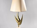 an image of a lamp with a gold shade on it