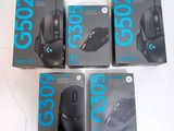 four boxes of computer mouses sitting on top of a white surface