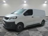 the white van is parked on a checkered tile floor