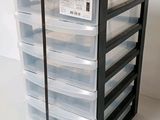 an image of a stack of plastic drawers on a white surface