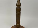 pair of antique brass candlesticks on a wooden base