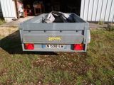 a trailer with a bag in the back of it