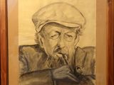 painting of an old man smoking a pipe in a wooden frame