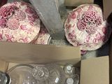 a box full of empty glass bottles on the floor