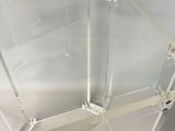 a glass table with a glass top and a metal base
