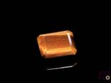 an image of a piece of wood on a black surface