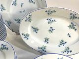 a lot of plates that are sitting on a table