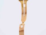 a gold watch with a black strap on it