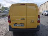 a yellow van parked on the side of the road