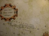 a large globe with a picture of a ship on it