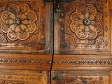 a large wooden cabinet with a bunch of drawers inside of it