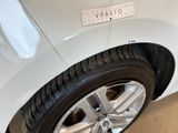 a white car with a sticker on the side of it
