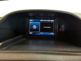 a picture of a car dashboard with a digital display