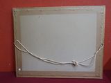 a picture of a picture hanging on a red wall