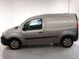 the van is parked in a white room with a white floor