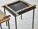 two tables that have a chalk board on top of them