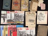 several old books are on a table with a black table cloth